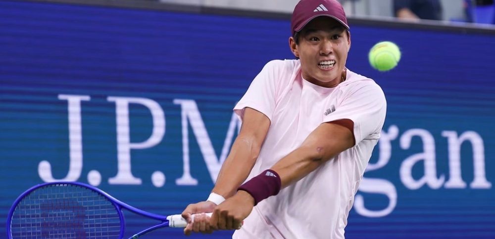 James Duckworth hitting a two-handed backhand at a professional tournament